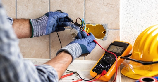 electrician working on outlet
